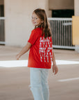 Kids Christian ‘True Identity – I Am’ t-shirt featuring bold ‘I Am’ text on the front and encouraging words like Loved, Blessed, Chosen, and Child of God on the back; soft 100% cotton tee for everyday comfort.